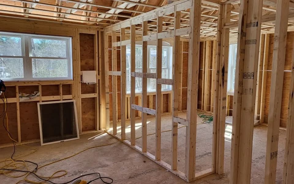 Building permit card posted in the window of a Massachusetts home during a remodel