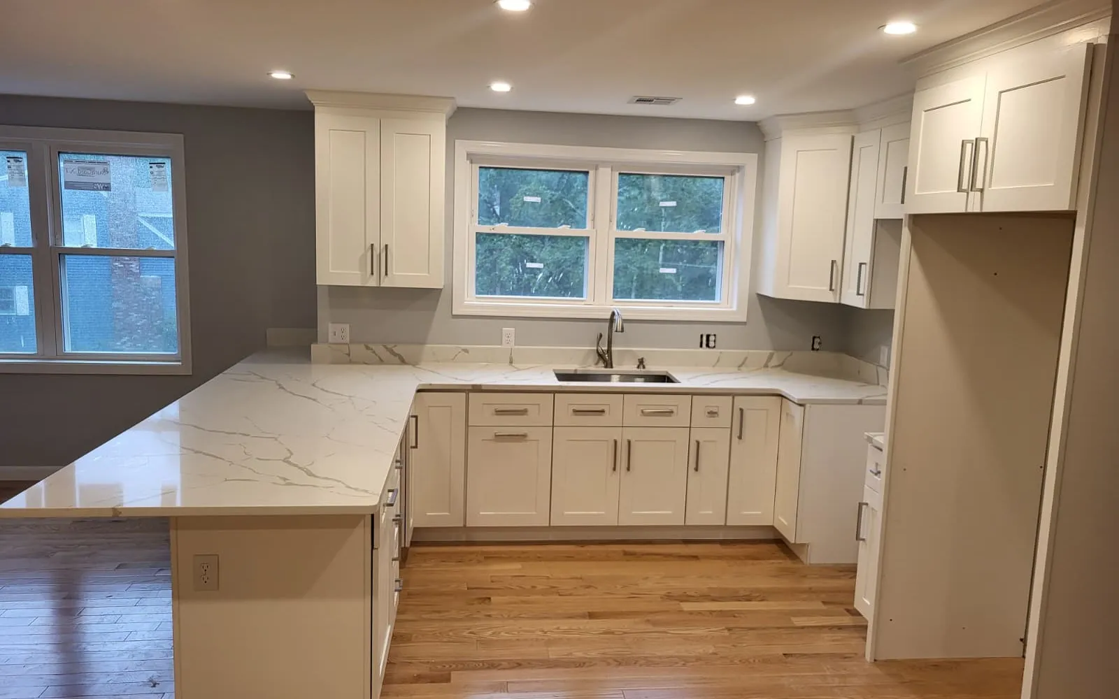 Remodeled kitchen with wood cabinets and granite countertops in a Central Massachusetts home