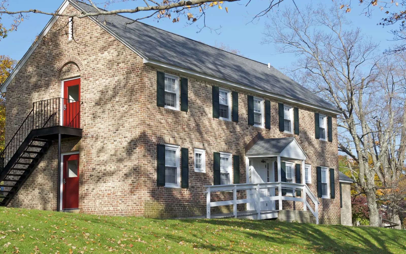 Exterior wood stairs and deck on a multi-family home similar to many in Clinton, Massachusetts