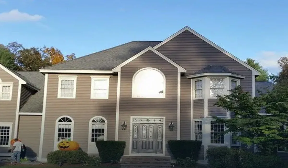 Two-story colonial home with new siding, windows and front entry in Central Massachusetts
