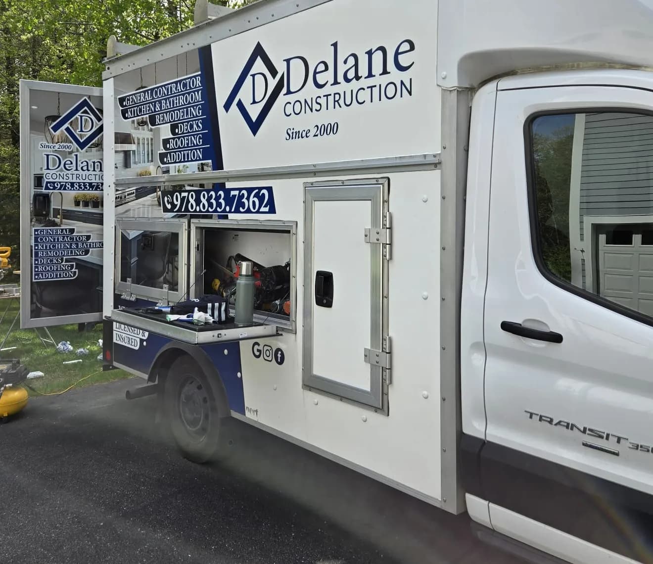 Delane Construction work truck with the company logo on a job site